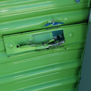 Extra Space Storage - Front view of storage door damage on attempt break-in - Self Storage Near Me - Palm Springs, California Extra Space Storage - Front view of storage door damage on attempt break-in - Self Storage Near Me - Palm Springs, California