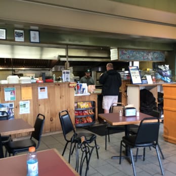 Italian Carry Out - a man preparing food in a restaurant - Italian Near Me - Ithaca, New York Italian Carry Out - a man preparing food in a restaurant - Italian Near Me - Ithaca, New York