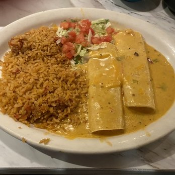 Chuy's - Cheese Enchilada with queso sauce (+$1.50) and double rice (~$13) - Mexican Near Me - Plano, Texas Chuy's - Cheese Enchilada with queso sauce (+$1.50) and double rice (~$13) - Mexican Near Me - Plano, Texas