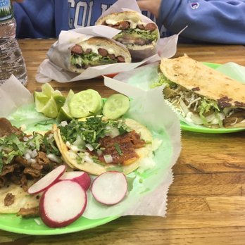Taco Mix - counter-clockwise from bottom: tacos chicos ("small" tacos) - one tripe and al pastor - quesadilla chicharron, and torta salchipapa - Mexican Near Me - New York, New York Taco Mix - counter-clockwise from bottom: tacos chicos ("small" tacos) - one tripe and al pastor - quesadilla chicharron, and torta salchipapa - Mexican Near Me - New York, New York