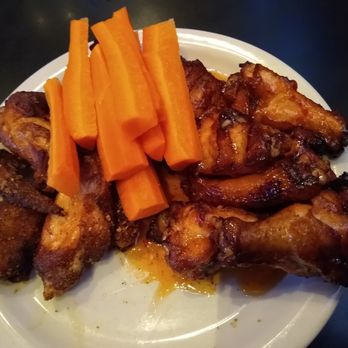 Kilroys Bar and Grill - $17.99 smoked then flash fried wings with half dry rub and half sweet Thai chili and fresh carrots - New American Near Me - Indianapolis, Indiana