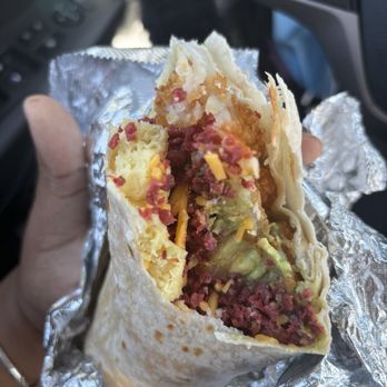 Lilis Vegan Breakfast - Bacon Breakfast Burrito 100% plant base (egg, bacon, tater tots, cheese, caramelized onions, avocado) - Vegan Near Me - Culver City, California Lilis Vegan Breakfast - Bacon Breakfast Burrito 100% plant base (egg, bacon, tater tots, cheese, caramelized onions, avocado) - Vegan Near Me - Culver City, California