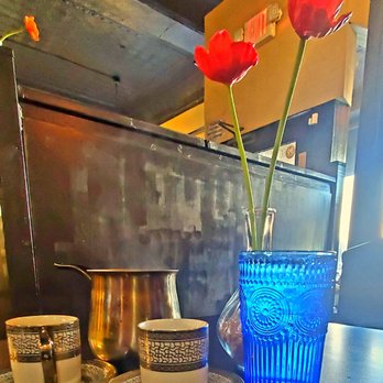 Kari's on 39th - a blue vase with three red flowers - Mediterranean Near Me - Kansas City, Missouri Kari's on 39th - a blue vase with three red flowers - Mediterranean Near Me - Kansas City, Missouri