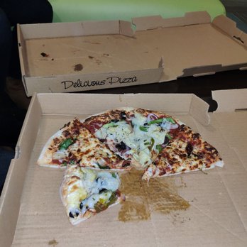 Rick’s Pizza - a half eaten pizza in a box - Pizza Near Me - Richmond, Virginia