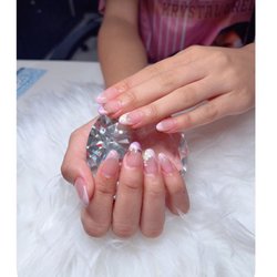 T's Hair and Nail Salon - We love to do our nails no ther than TINA.Shes great and friendly.