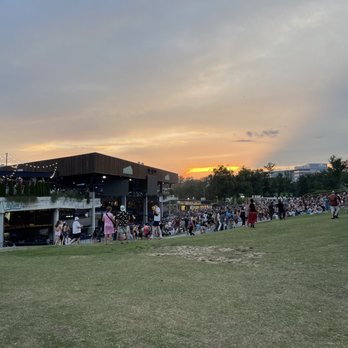 Merriweather Post Pavilion - a crowd of people standing on the grass - Music Venues Near Me - Columbia, Maryland