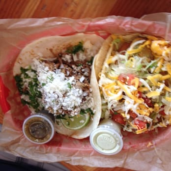 Torchy's Tacos - On the left is the Green Chili Taco. On the right it's the Fried Avocado Taco. - Tex-Mex Near Me - Austin, Texas Torchy's Tacos - On the left is the Green Chili Taco. On the right it's the Fried Avocado Taco. - Tex-Mex Near Me - Austin, Texas