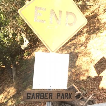 Garber Park - The bright sun beaming on the entrance sign from Evergreen Ave - Hiking Near Me - Berkeley, California