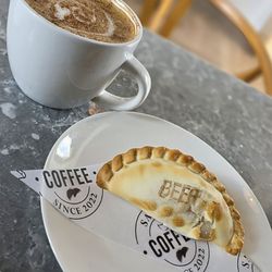 Sanyos Coffee - Cafe con Leche and a beef empanada