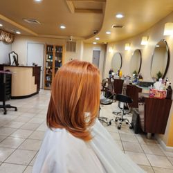 Shanel Hair Salon - Bold Orange Transformation on Black Hair