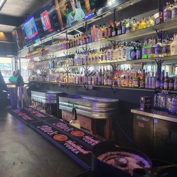 The Dizzy Rooster - Behind the bar - Sports Bars Near Me - Austin, Texas