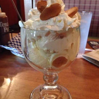 Famous Daves - Down home banana pudding it has whipped banana pudding and layers of fresh cookies and bananas. Topped with fresh whipped cream. - Barbeque Near Me - Long Beach, California Famous Daves - Down home banana pudding it has whipped banana pudding and layers of fresh cookies and bananas. Topped with fresh whipped cream. - Barbeque Near Me - Long Beach, California