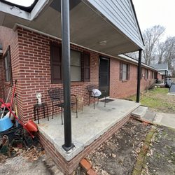 More Than Enough Property Maintenance - Power washed, scrapped and sanded all handrails at complex. Primed and painted with Sherwin Williams paint for metal.