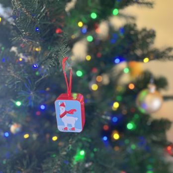 See's Candies - a christmas ornament hanging from a christmas tree - Candy Stores Near Me - Phoenix, Arizona