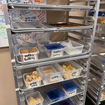 Just Add Chocolate - trays of food on a shelf - Chocolatiers & Shops Near Me - Lehi, Utah