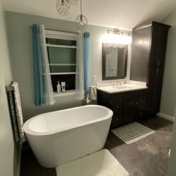 HM Remodeling - Tub and custom vanity with storage