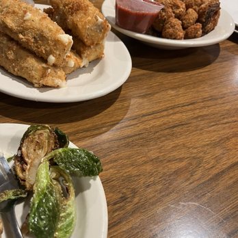 Chuck's Restaurant - In the background, you can see the beer as well as the mushrooms, the huge mozzarella sticks and the brussels sprouts to the forefront - Pizza Near Me - Des Moines, Iowa