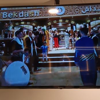 Bekdash Ice Cream - TVs inside show loop of promotional video, showing what appears to be location of Bekdash in Jordan. - Ice Cream & Frozen Yogurt Near Me - Temple Terrace, Florida Bekdash Ice Cream - TVs inside show loop of promotional video, showing what appears to be location of Bekdash in Jordan. - Ice Cream & Frozen Yogurt Near Me - Temple Terrace, Florida