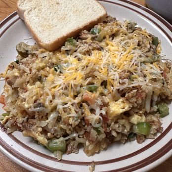 AJ's Cafe - Veggie skillet with sausage added! - A plate of veggie skillet with cheese, served with two slices of white bread, on a diner-style plate. - Cafes Near Me - Omaha, Nebraska