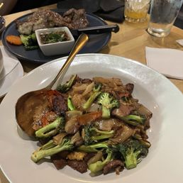 Beef Pad See Ew (Mild Spice) and Lao Ribeye Steak Beef Pad See Ew (Mild Spice) and Lao Ribeye Steak