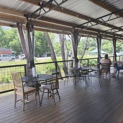 Spring Creek Tavern - Outdoor riverside patio.