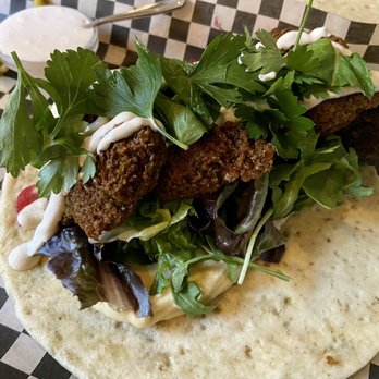 Ciudad - Fava Bean Falafel Sandwich with Smoked Yogurt - Tapas/Small Plates Near Me - Seattle, Washington Ciudad - Fava Bean Falafel Sandwich with Smoked Yogurt - Tapas/Small Plates Near Me - Seattle, Washington