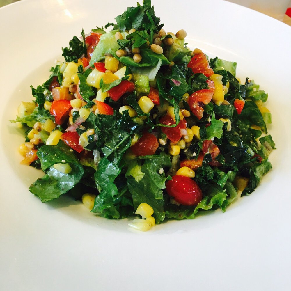 Vinaigrette - THE OMEGA: Greens, sweet corn, diced bell pepper, tomato, avocado, red onion, cilantro, toasted pine nuts, blue cheese vinaigrette - Salad Near Me - Austin, Texas Vinaigrette - THE OMEGA: Greens, sweet corn, diced bell pepper, tomato, avocado, red onion, cilantro, toasted pine nuts, blue cheese vinaigrette - Salad Near Me - Austin, Texas
