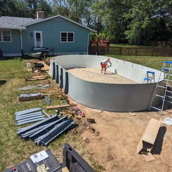 Koneck Contracting - Spreading sand for the liner base. - General Contractors Near Me Koneck Contracting - Spreading sand for the liner base. - General Contractors Near Me