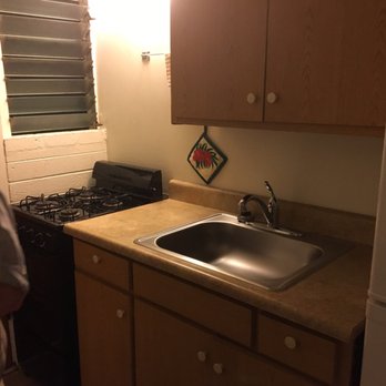 Dolphin Bay Hotel - The drawers have cutlery and the cabinets have pots and pans - Hotels Near Me - Hilo, Hawaii