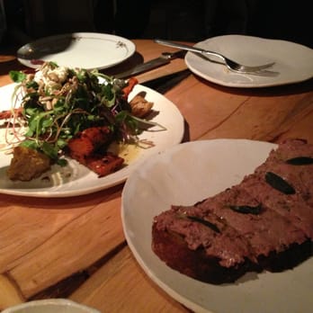 ABC Kitchen - Roast carrot and avocado salad, crunchy seeds, sour cream and citrus in the back. Chicken liver toast in the foreground. - Breakfast & Brunch Near Me - New York, New York