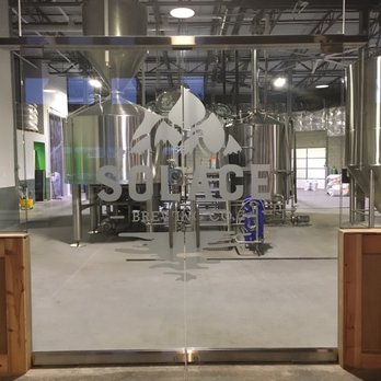 Solace Brewing Company - Glass wall looking at the tanks behind the bar area - Breweries Near Me - Sterling, Virginia Solace Brewing Company - Glass wall looking at the tanks behind the bar area - Breweries Near Me - Sterling, Virginia
