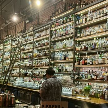Paper Plane - Wall of alcohol - Cocktail Bars Near Me - San Jose, California
