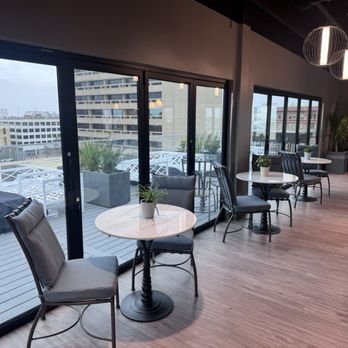 The Rooftop Bar - Inside view looking out on west side patio. - New American Near Me - Galveston, Texas The Rooftop Bar - Inside view looking out on west side patio. - New American Near Me - Galveston, Texas
