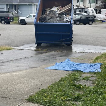 Top choice property services - Bin contents being dumped into my driveway - Roofing Near Me