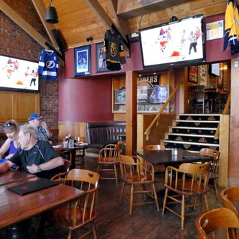 Jimy Mac's Pub - a man and a woman sitting at a table - Pubs Near Me - Langley, British Columbia