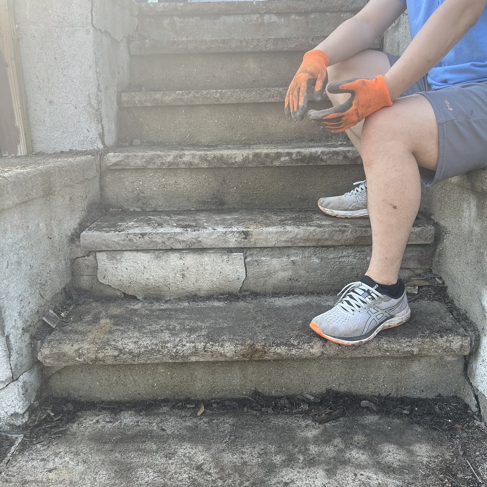 Lamacchia Landscape Construction - a man sitting on the steps - Landscaping Near Me - Newton, Massachusetts