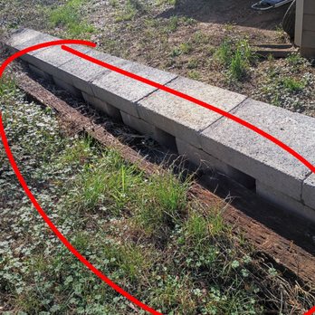 Stone Rose Outdoor Designs - Previous rotten retaining wall that was supposed to be demolished and removed according to contract. - Landscaping Near Me Stone Rose Outdoor Designs - Previous rotten retaining wall that was supposed to be demolished and removed according to contract. - Landscaping Near Me