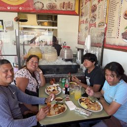 A bunch of quesabirrias, chilaquiles, and shrimp and steak plate. A bunch of quesabirrias, chilaquiles, and shrimp and steak plate.