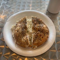 an everything bagel with chicken salad an everything bagel with chicken salad