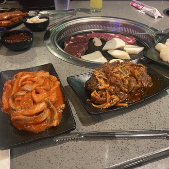 KPOT Korean BBQ & Hot Pot - Spicy calamari, spicy beef bulgogi and scallops waiting for their turn on the grill. - Korean Near Me - Webster, Texas KPOT Korean BBQ & Hot Pot - Spicy calamari, spicy beef bulgogi and scallops waiting for their turn on the grill. - Korean Near Me - Webster, Texas