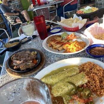 Chuy's - Steak fajitas, chicken boom enchiladas, and flautas. Blended strawberry margarita in lower left. - Mexican Near Me - Florence, Kentucky