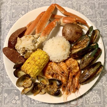 Kickin Kajun - Mini Combo - 1/2 lb of snow crab, shrimp. mussels, clams, sausage, corn, rice, potato. - Cajun/Creole Near Me - Honolulu, Hawaii
