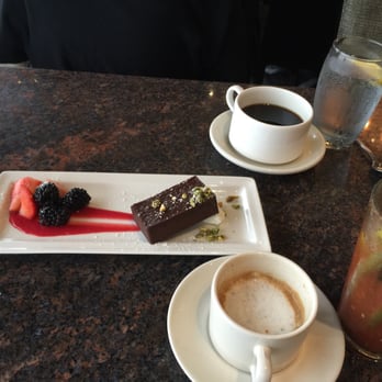 Skates On The Bay - Flourless chocolate cake a top raspberry sauce, pistachios and fresh fruit! Decadent dense Yum! - Seafood Near Me - Berkeley, California Skates On The Bay - Flourless chocolate cake a top raspberry sauce, pistachios and fresh fruit! Decadent dense Yum! - Seafood Near Me - Berkeley, California