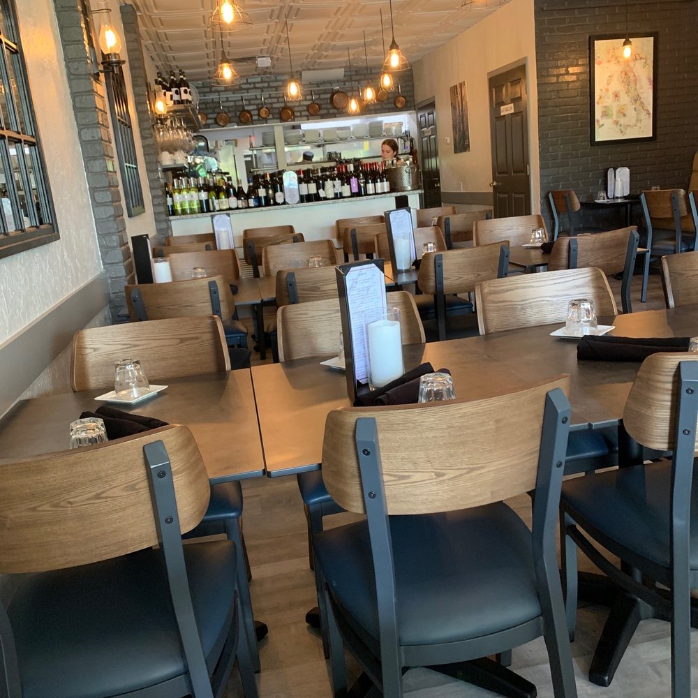 San Marco - tables and chairs in a restaurant - Italian Near Me - Venice, Florida San Marco - tables and chairs in a restaurant - Italian Near Me - Venice, Florida