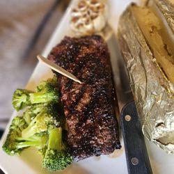 Black Woods Grill & Bar - New York strip, steamed broccoli and baked potato
