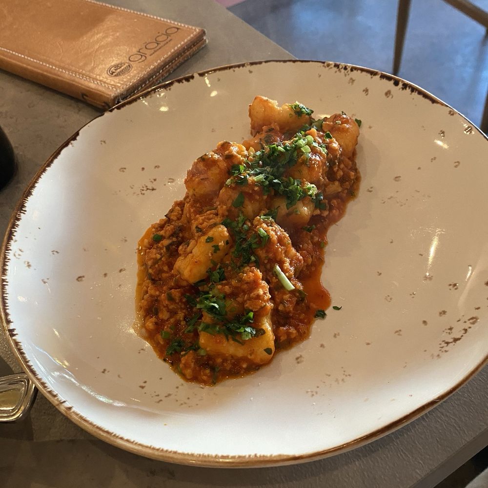 Gràcia Mediterranean - Calamari bolognese - Cocktail Bars Near Me - Austin, Texas Gràcia Mediterranean - Calamari bolognese - Cocktail Bars Near Me - Austin, Texas