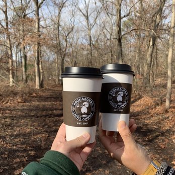 Kookaburra Coffee - two people holding coffee cups - Coffee & Tea Near Me - Rockville Centre, New York