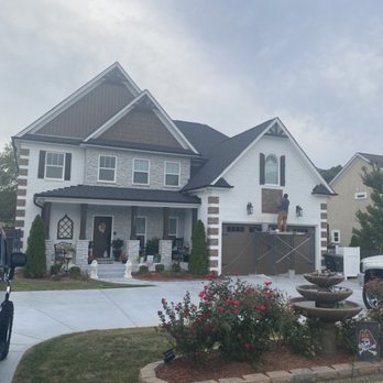 Amcc Painting - Exterior brick paint, stone, and stained wood. Painted drive way as well. - Painters Near Me