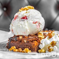Twist It Top It - Rocky Road Brownie topped with strawberry cheesecake ice cream and chopped walnuts