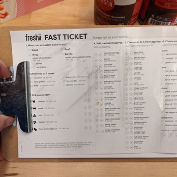 Freshii - a person cutting a fast ticket on a cutting board - Vegetarian Near Me - Edmonton, Alberta Freshii - a person cutting a fast ticket on a cutting board - Vegetarian Near Me - Edmonton, Alberta